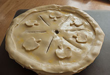 The decorated apple pie ready to bake