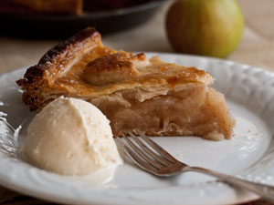 A slice of apple pie with ice cream