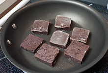 A pan full of kintsuba frying