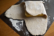 The plus-shaped dough with butter partially folded in