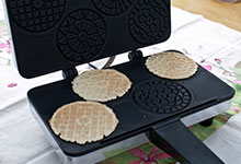 Cooked pizzelles on a pizzelle iron